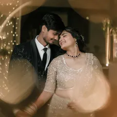 It's in these unscripted, in-between moments that the truest emotions shine. We focus on capturing the genuine connection and quiet intimacy, where a simple touch and a shared smile speak volumes, framed by the soft glow of celebration.