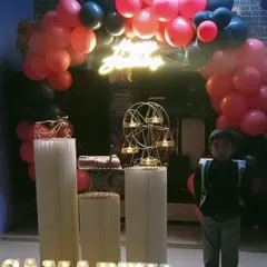 Here’s a fun birthday setup for a young boy, featuring a vibrant pink and black balloon arch. I included a custom neon sign and marquee letters spelling out his name, "SAMARTH", to make him feel like the star of the show.