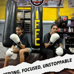 Our female fighters are a core part of the Iron Fist family. Here they are, gloved up and ready, demonstrating the focus and determination that defines our team.
