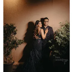 A dramatic and moody shot of Isha and her partner. Her cocktail party makeup featured a smokey eye and contoured cheeks, perfect for this high-fashion look.