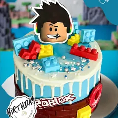 A vibrant Roblox-themed cake for a young gamer. This design features a character avatar and colorful building blocks, bringing the popular online game to the birthday table.