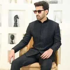 A relaxed yet poised look in the black textured Jodhpuri suit. The sharp tailoring and modern design make it a versatile piece for any stylish gentleman's wardrobe.
