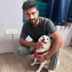 Bunni getting a birthday cuddle from another one of his favorite humans. The bond between our staff and the dogs is truly special.
