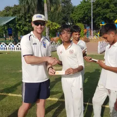 A handshake between my young student and an international player. Moments like these inspire them to dream big.