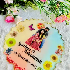 An overhead shot of the 8-inch resin plaque, highlighting the clarity of the photo and the vibrant colors of the dried flowers against the blended background.