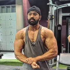 This was me four weeks out from the Sheru Classic. You can see the vascularity and conditioning coming through. My contest prep diet and peak week strategy are designed to get you this dry, shredded look under the stage lights.