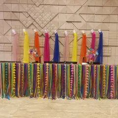 A colourful setup for a corporate Holi event. We decorated this table with multi-coloured ribbons and drapes, topped with pinwheels, to create a cheerful and festive awards or display area.