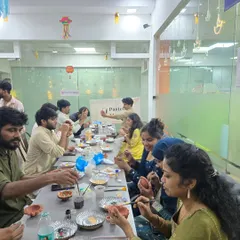 I can bring the entire pottery workshop right to your office. Here’s a look at a full team engaged in a festive diya painting session, a perfect way to celebrate together.