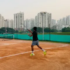 A student demonstrates a solid backhand during a practice rally. Our training emphasizes building a complete game with reliable strokes from both wings.