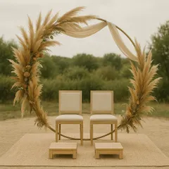 A beautiful bohemian-style mandap featuring a circular arch adorned with dried pampas grass. This rustic and earthy design is perfect for couples seeking a unique and natural aesthetic.