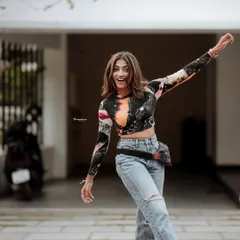 A joyful and energetic portrait capturing a candid moment of movement. I love bringing out the playful side of my subjects during a shoot.