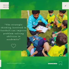 We believe the strategic thinking involved in football improves problem solving skills in academics. Here, a coach uses a strategy board to explain tactics.