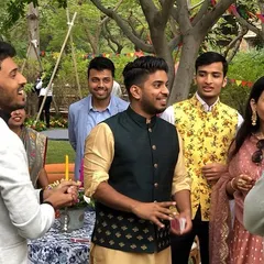 Performing for guests at a daytime sangeet function. The casual, festive atmosphere of pre-wedding events is perfect for my style of walk-around magic, helping your friends and family connect and have fun.