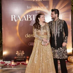Our client and his partner posing at a "Raabta" night event. His bespoke embroidered kurta stands out, showcasing the elegance and craftsmanship we bring to every piece.