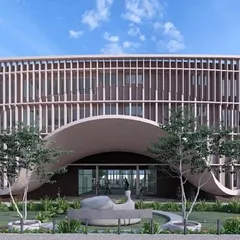 The facade of JAV Junior College in Bellary showcases our use of rhythmic vertical fins and a sweeping arched entrance. This design is not just aesthetically striking; it is a climate-responsive solution that modulates sunlight and creates a welcoming, modern identity for the institution.