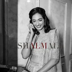 A classic, vintage-inspired black and white portrait of the bride on the phone.