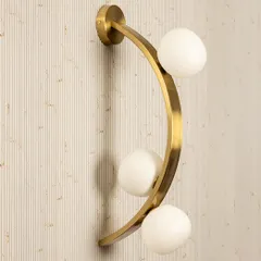 For a clean, contemporary look, I often recommend this Triple Globe Wall Light. The combination of a sleek gold frame and soft opal globes provides a balanced, ambient glow. It works beautifully in pairs in a hallway or as a sophisticated bedside light.