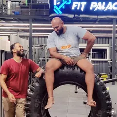 Sharing a lighthearted moment with a friend and client at the gym. Building strong relationships is just as important as building strong muscles, and it's a big part of our community vibe.