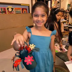 Another happy student with her beautiful, handmade Mother's Day flower basket. It's a joy to help them create something special for their awesome moms.