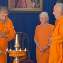 The ceremonial lighting of the lamp, a ritual that symbolizes the dispelling of darkness and the welcoming of divine light and knowledge. These moments are filled with grace and peace.
