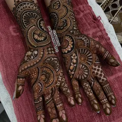 This is a classic example of a full bridal set, with matching intricate designs on both hands. The patterns are dense and detailed, ensuring your hands are the center of attention.