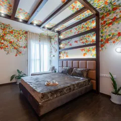 The beauty of nature, brought indoors. This view of the Sakura master bedroom highlights the stunning hand-painted ceiling mural, rich textures, and elegant wooden beams that create a perfect cozy retreat.