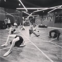 Flexibility in progress. Our youngest dancers work on their backbends and other stretches, building a foundation for more advanced moves while having fun.