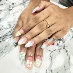 A beautiful watercolor or "blooming gel" effect. I created this multi-colored flower petal design on each nail for a soft and artistic look.