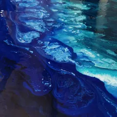 This is a close-up of the first layer of an abstract seascape. I use fluid art techniques to create the organic movement of water and waves, playing with different shades of blue.