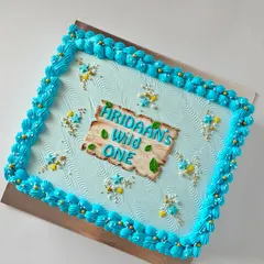 Another view of the "Wild One" sheet cake. The simple but themed design ensures that even the serving slices are part of the celebration's aesthetic.