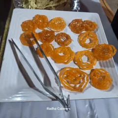 Hot, crispy Jalebis being served at a society event in Ashok Nagar. Live counters for sweets and snacks are a great way to add excitement to community celebrations.