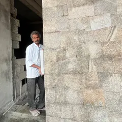 A portrait of the master mason responsible for the beautiful stonework on one of our projects. We honor the skill and dedication of the craftspeople we work with.