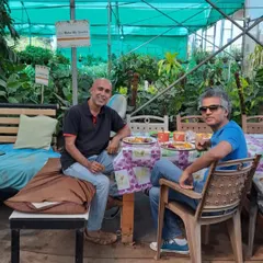 A happy moment catching up with an old friend at the nursery. Our garden is not just a place of business, but a space for connection, conversation, and community.