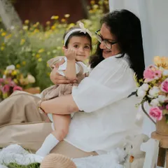 A mother's love. This tender moment between a mother and her daughter during their outdoor picnic session is what memory-making is all about.