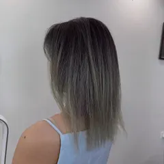 A short hair transformation. We went for a modern, textured cut with an ash ombre color, creating a look that is both edgy and chic.