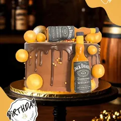 Cheers to a bold celebration with this Jack Daniel's themed cake. It features edible whiskey bottle replicas and a rich chocolate truffle base, making it a perfect surprise for a milestone birthday.