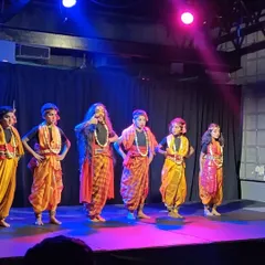 Look at these young stars lighting up the stage! Dressed in vibrant costumes for a folk performance, they bring an incredible energy that fills the entire studio.