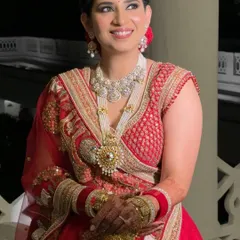 The perfect candid moment. Manika's smile shines, enhanced by a soft, timeless makeup look that highlights her natural beauty without overpowering it.