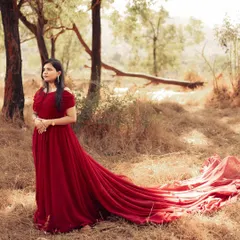 This off-shoulder red trail gown is one of my most requested pre-wedding outfits. Its long, flowing fabric creates beautiful movement in photos, perfect for a romantic shoot in nature.