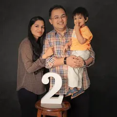 Two years of love and laughter. This classic family portrait marks a special second birthday milestone, with everyone together and smiling.