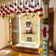 For a Gruha Pravesha, the pooja room is the heart of the home. We bring divinity and beauty to the space with intricate traditional flower arrangements, including delicate 'thomala' and hanging florals, creating a truly sacred ambiance.