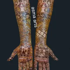 This design combines a small, subtle couple portrait with a bold initial 'A', making it a perfect and unique choice for an engagement or sangeet ceremony.