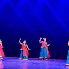 Our young performers in colorful costumes during a Kathak group dance. We focus on storytelling through dance, and this performance depicts a traditional tale with energy and grace.