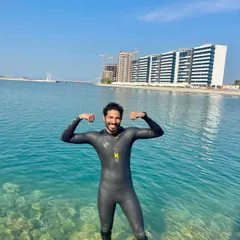Post swim success. A member of our Ironman training group celebrates after completing the swimming portion of the race, ready to transition to the bike.