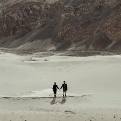 For the couple whose love is an adventure. Here in the vast, breathtaking landscapes of Ladakh, I captured the couple against the epic scale of the mountains, showing that their journey together is the greatest adventure of all.