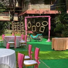 We love adding quirky and fun elements to our decor. This outdoor photo booth features a vintage scooter and hanging photo frames, creating a unique and interactive spot for guests to capture memories.