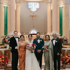 For this beautiful Catholic wedding ceremony, we created a look of timeless elegance for the entire family. The groom stands distinguished in a deep teal tuxedo, a perfect complement to the bride's classic white gown. We balanced the frame with the mothers in sage green and rusty rose gold, creating a family portrait that is warm, sophisticated, and perfectly in sync.