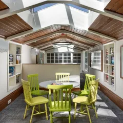 Another view of the repurposed 1920s attic, now a state-of-the-art workspace. The design prioritizes natural light and an open feel, making a once dingy and uninhabitable space both functional and inspiring for the staff.