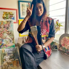 A self-portrait in my studio, surrounded by finished paintings and holding the tools of my trade. This space is a reflection of my journey as an artist.