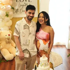 The happy parents-to-be share a laugh during their picnic-themed baby shower. I love creating a backdrop that not only looks beautiful but also becomes the setting for cherished memories like this one.